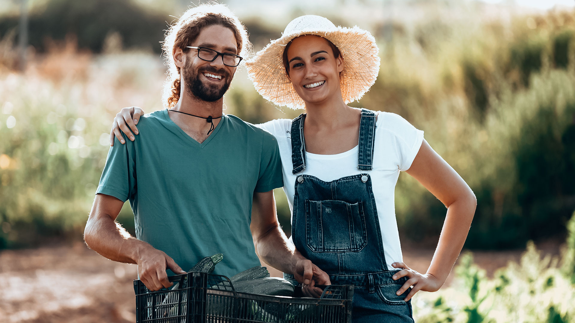 horticulturist-young-couple-harvesting-fresh-veget
